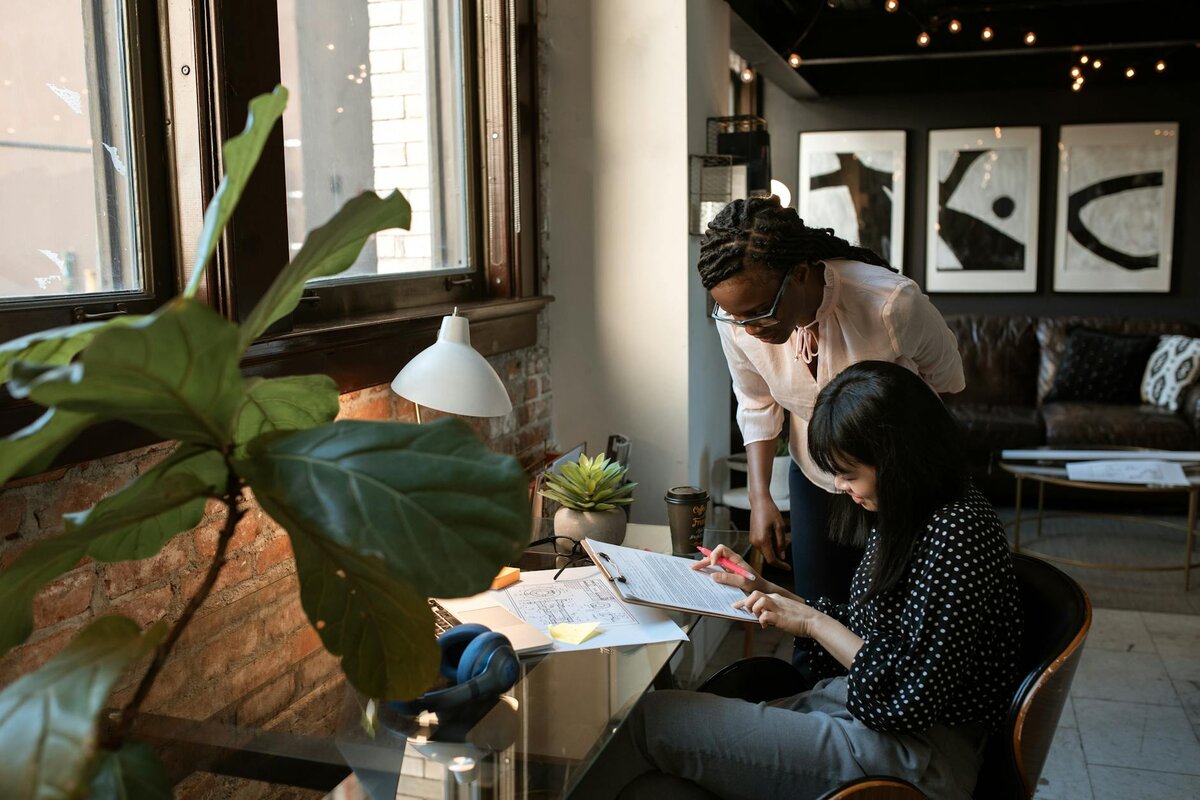 two women working on something 