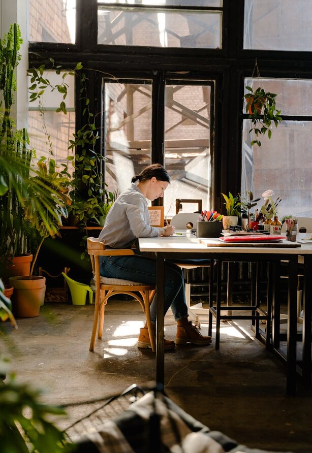 lady sitting at desk writing