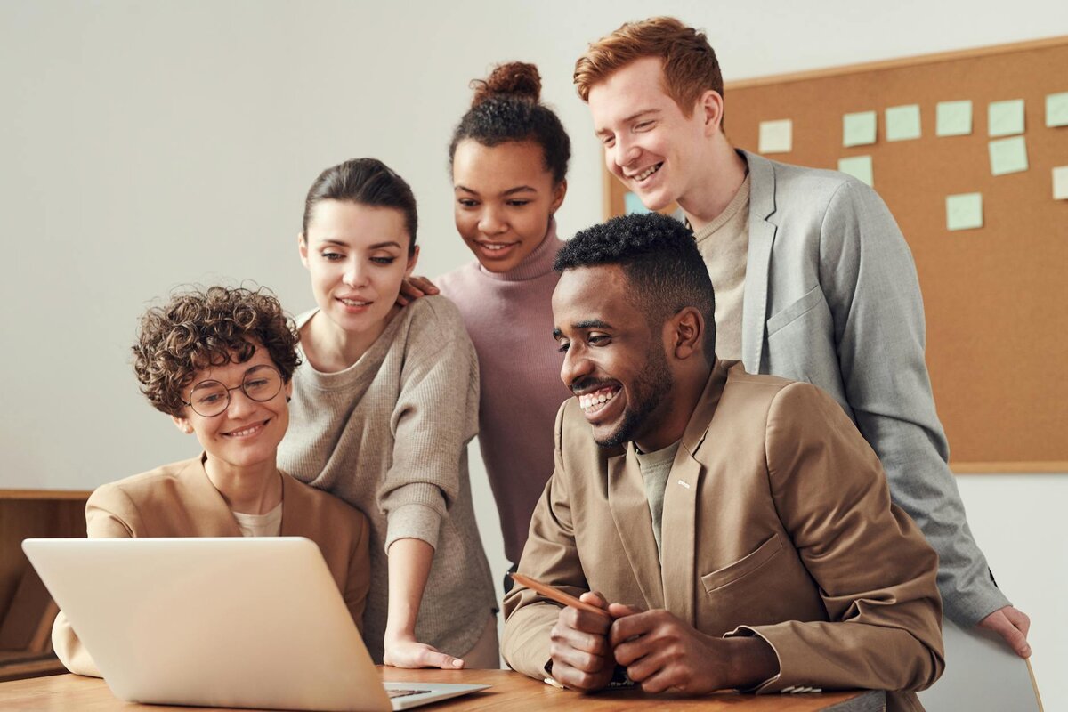 people looking at laptop