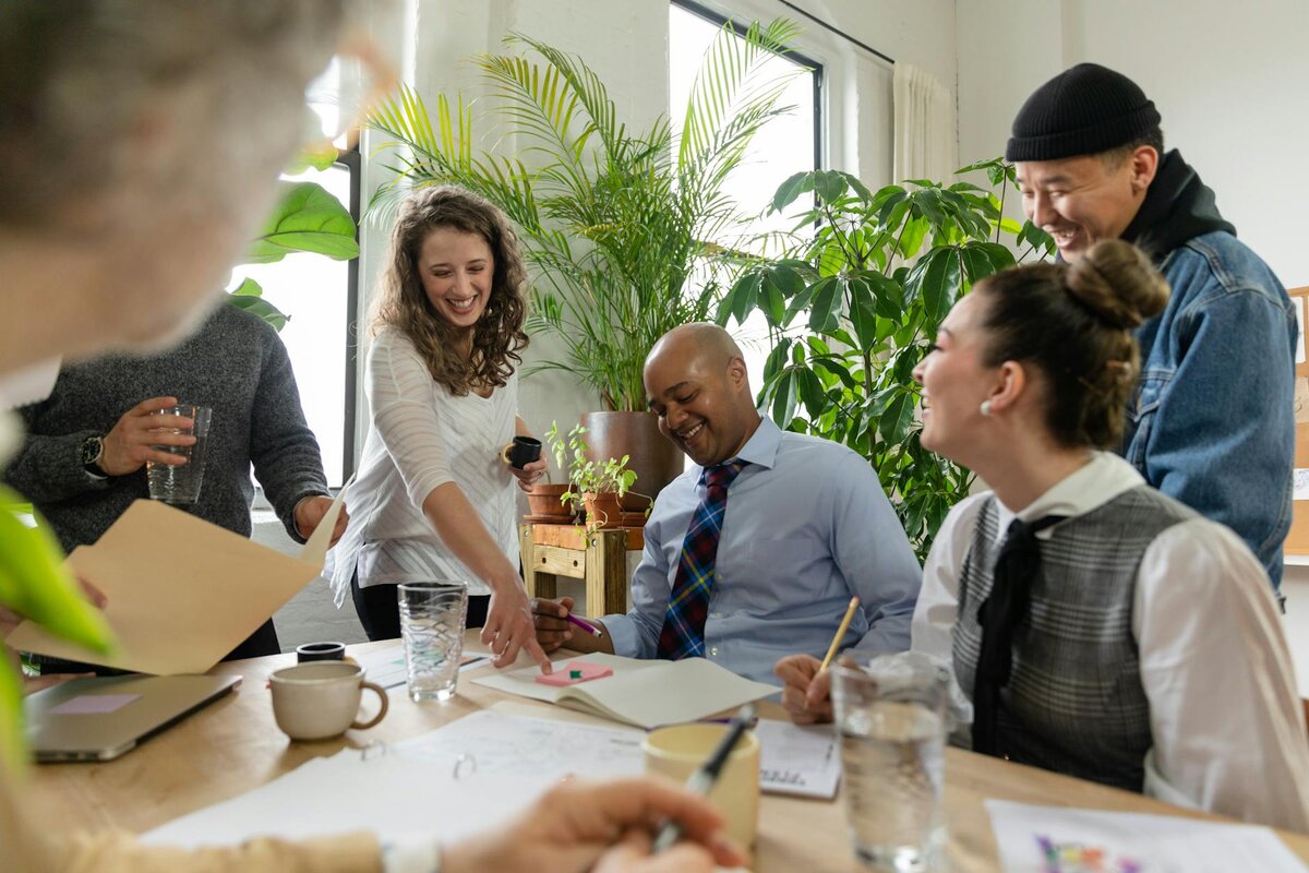 group of people working in office having a good time 