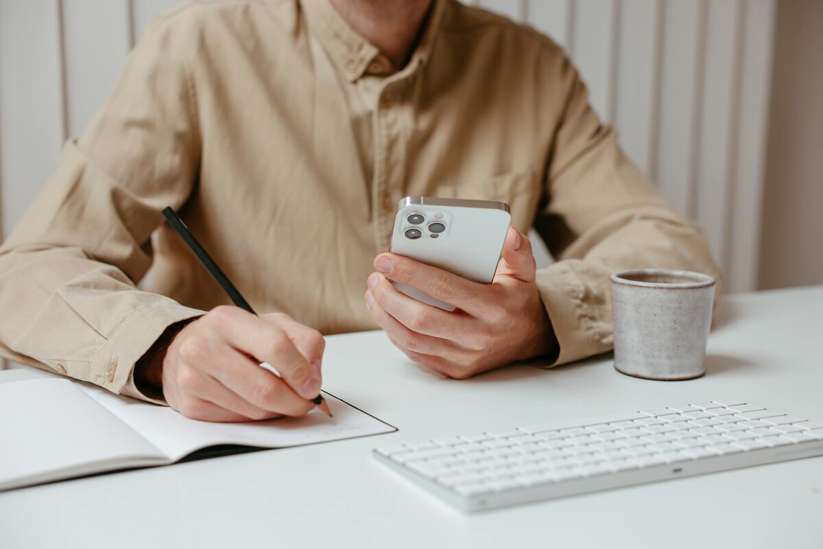Man focused in phone searching about the benefits of blind allowance