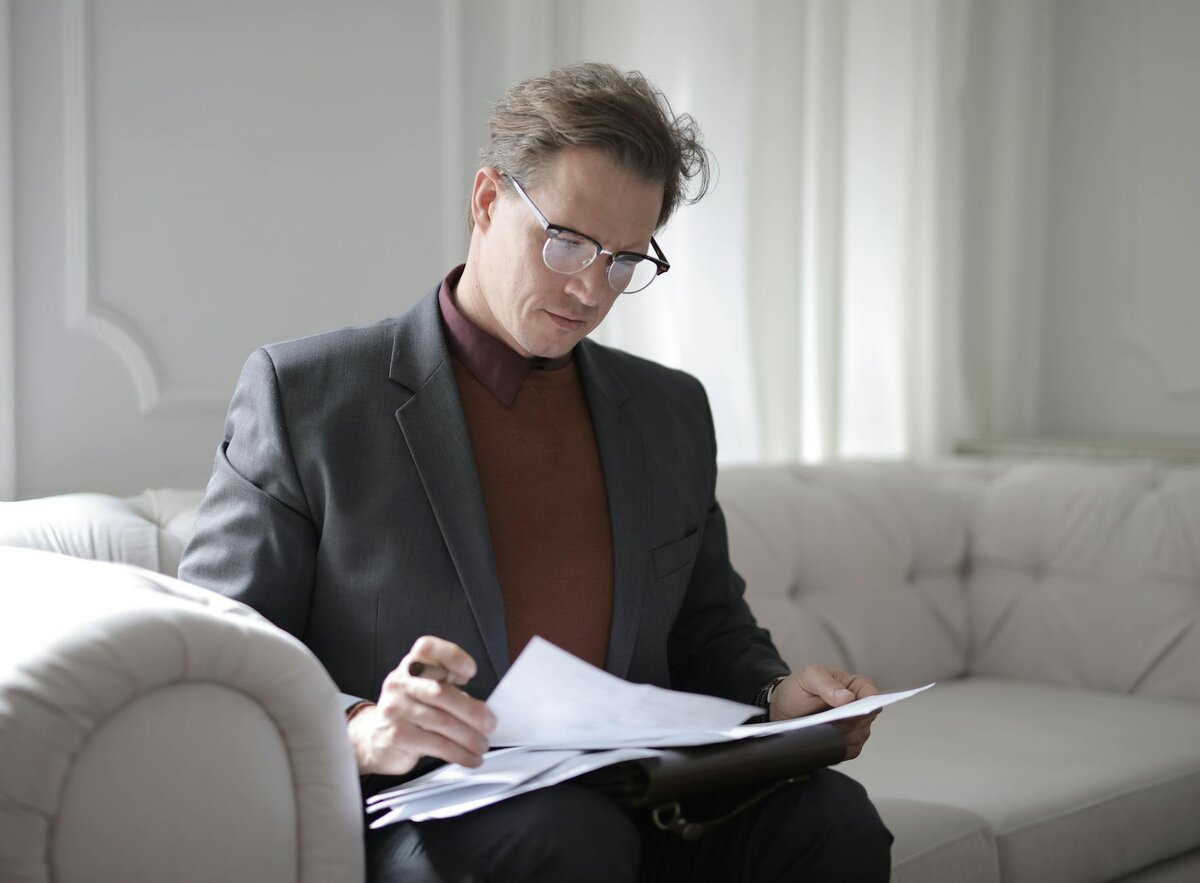 Man checking his monthly saving report