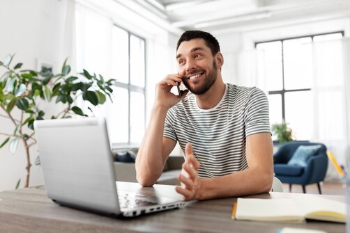 Self-employed worker managing finances and Universal Credit enquiries from home
