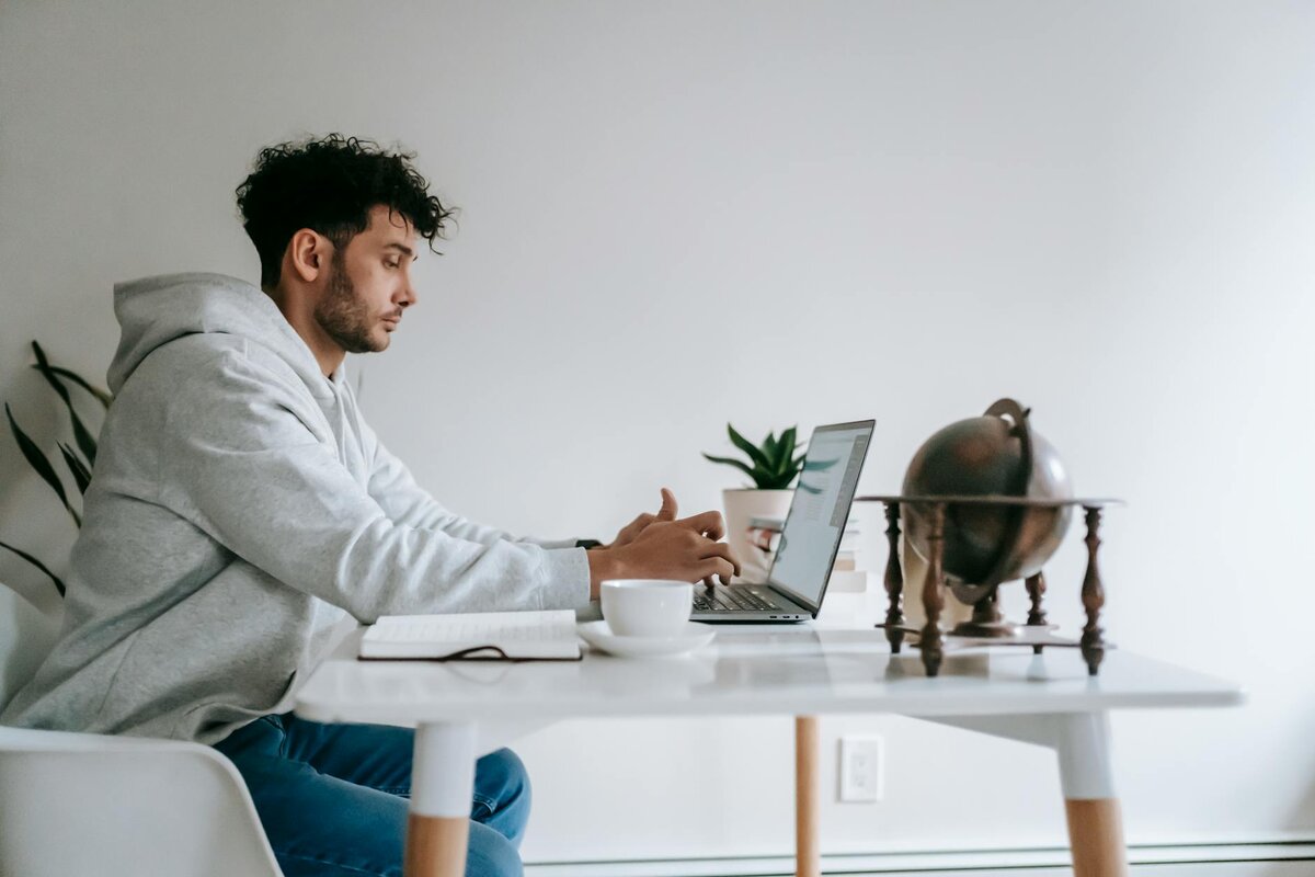 Working on a laptop at a table