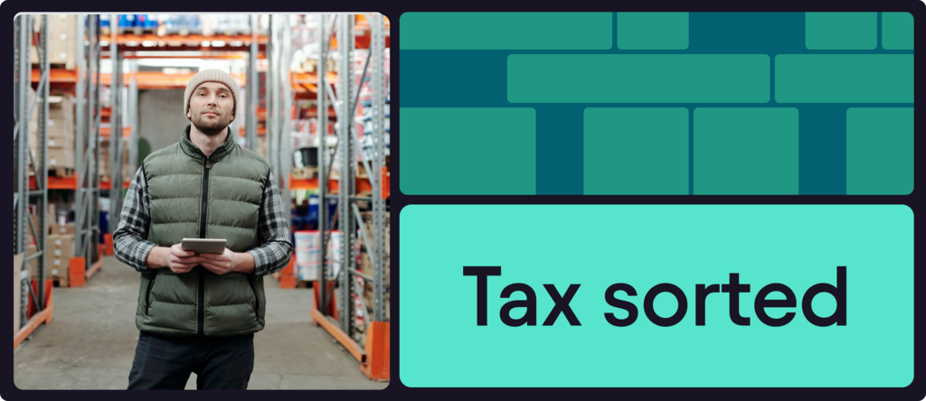 man in warehouse holding a tablet