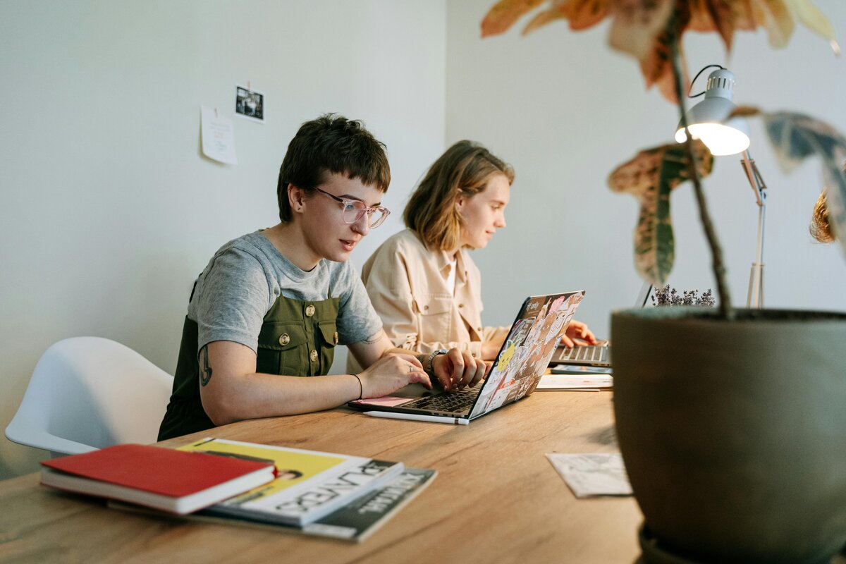 Two woman working on laptop