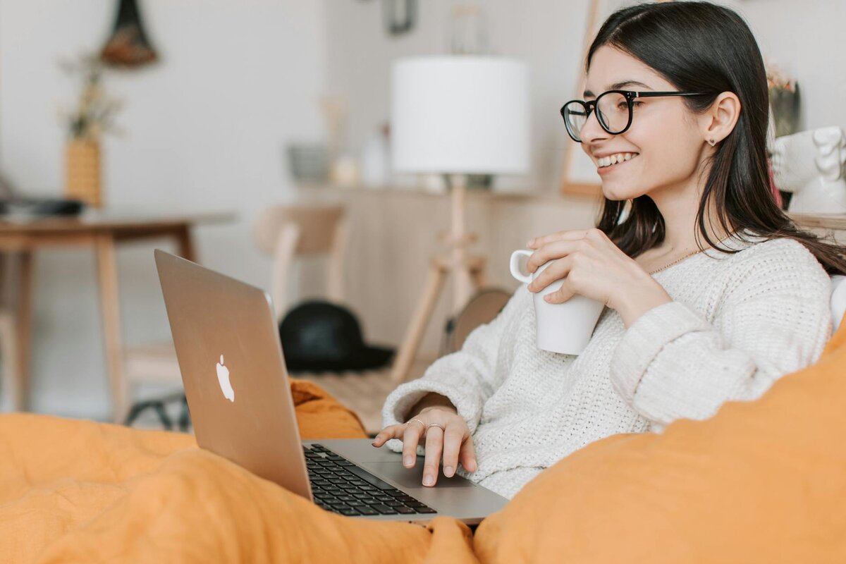 Lady with a cup of coffee in her bed