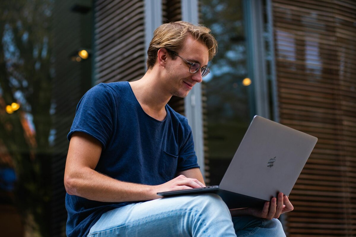 man on her laptop