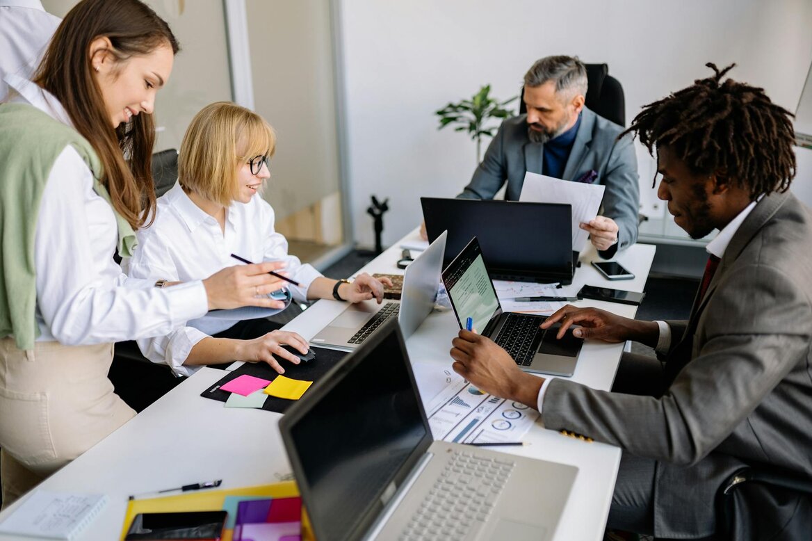 Business team analysing real-time tax insights using Pie Tax accounting app.