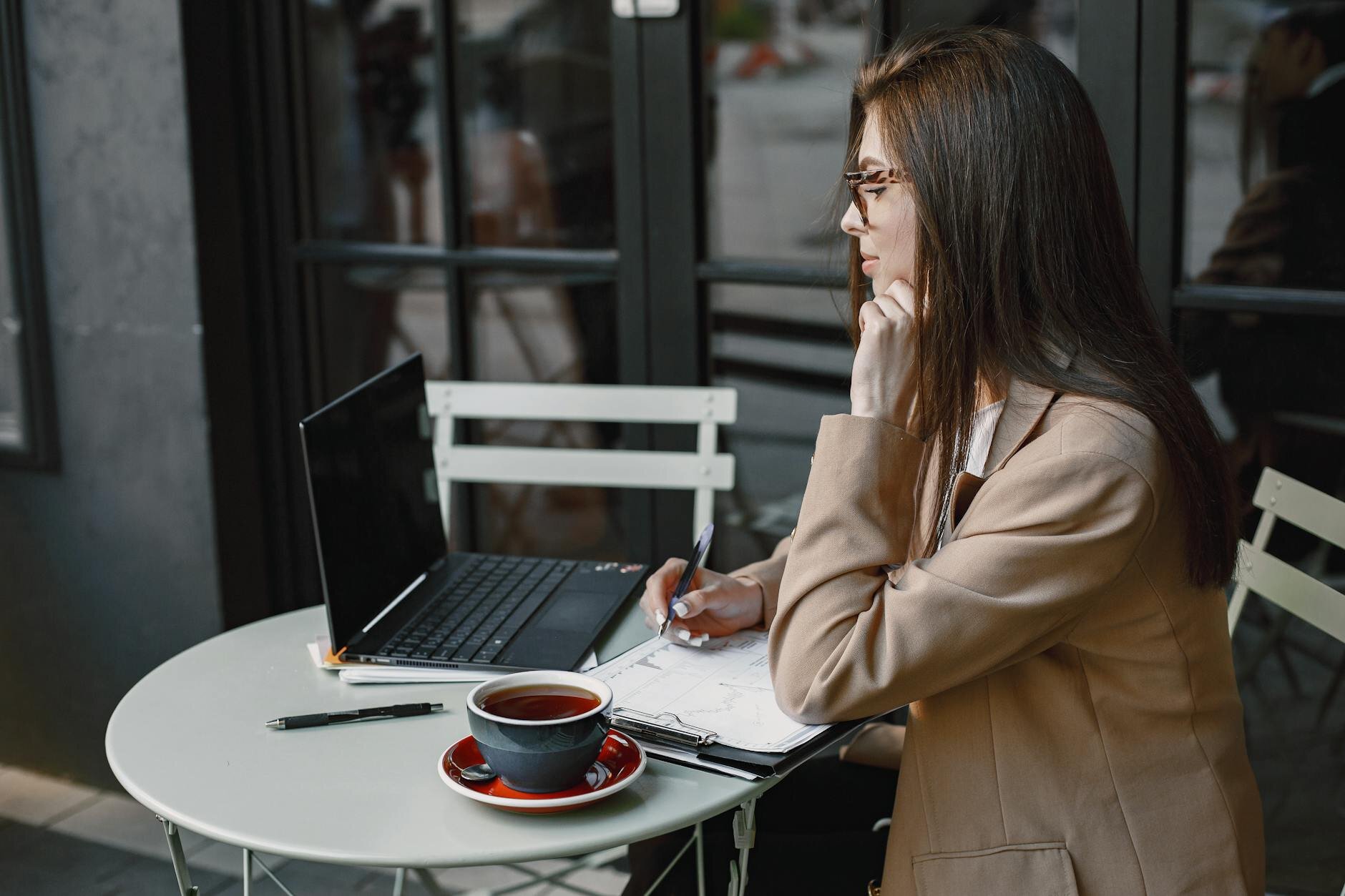 Woman working in her laptop checking her updates in 2 years worth of tax