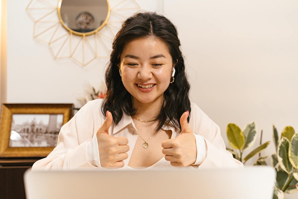 Happy girl with thumbs up