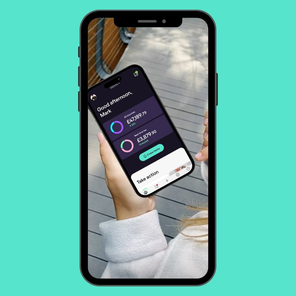 Person using Pie Tax app on mobile showing income dashboard with AI income insights and real-time tax updates