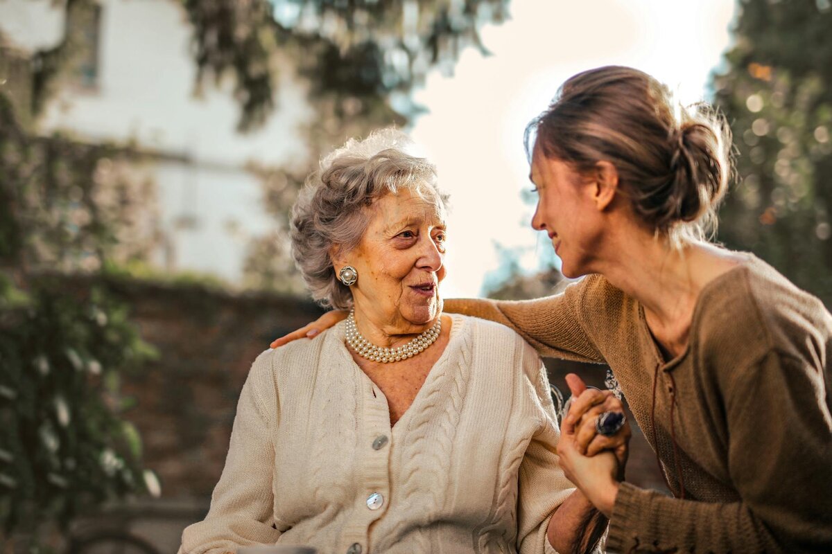 Two women talking to each other.