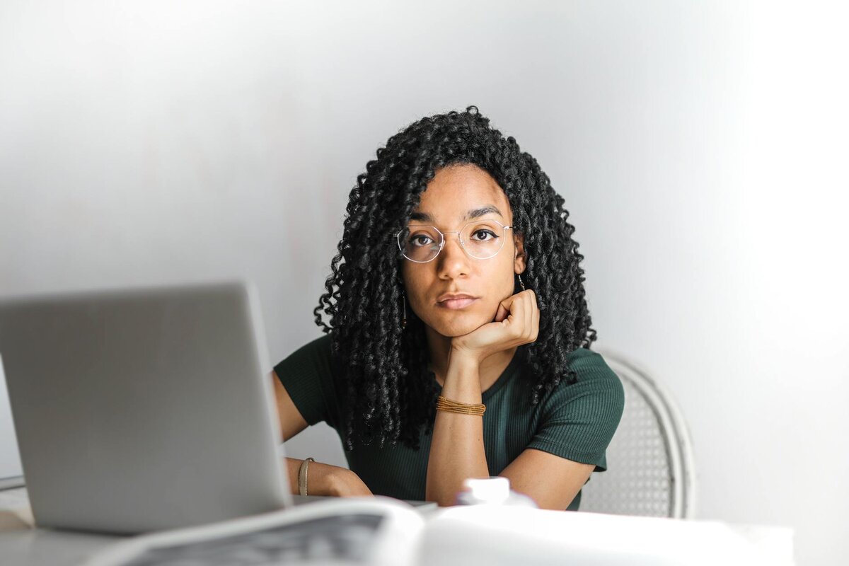 Busy woman checking her laptop about understanding the guide in Payment Account