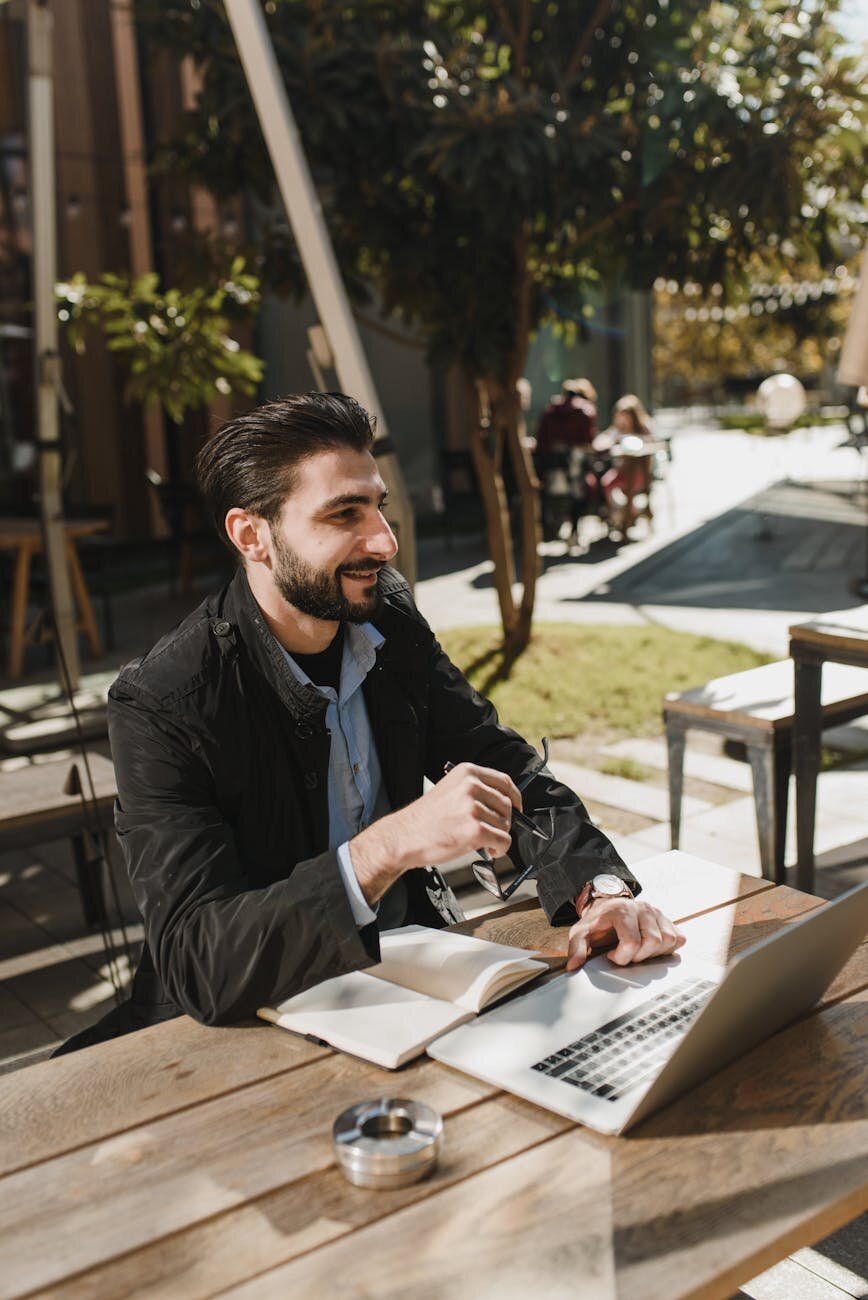 Self-employed professional using a laptop to manage finances and tax information