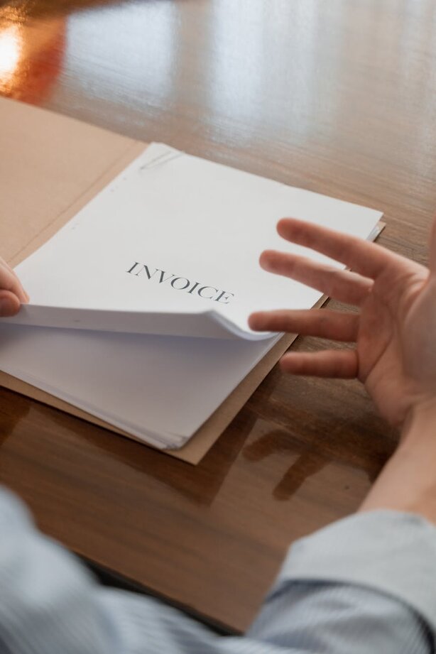hand with a document invoice