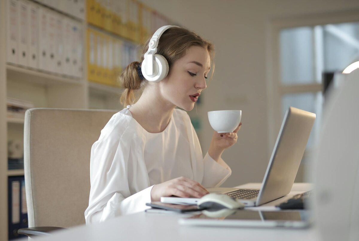 Professional woman working on her laptop searching about tax guide