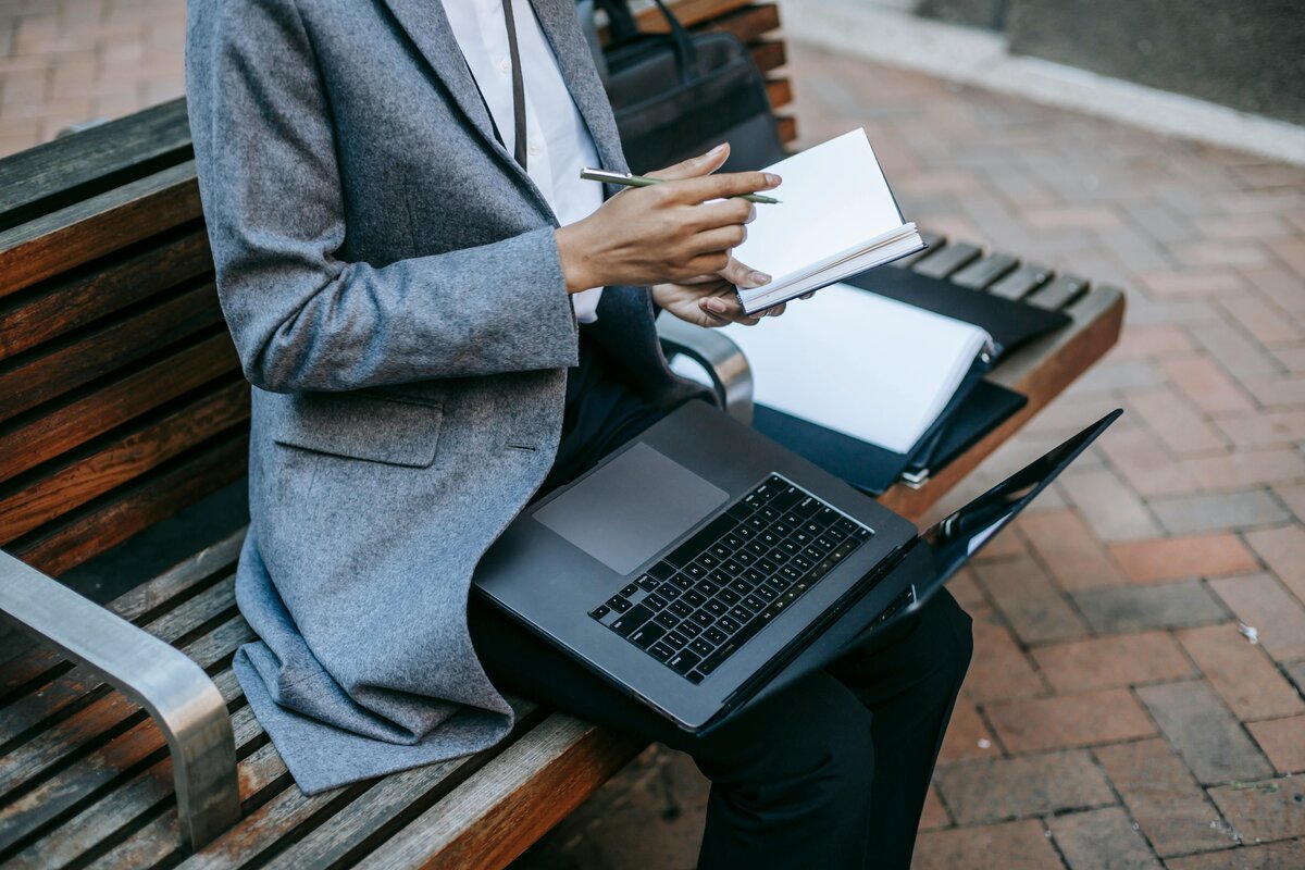Woman writing something on notebook